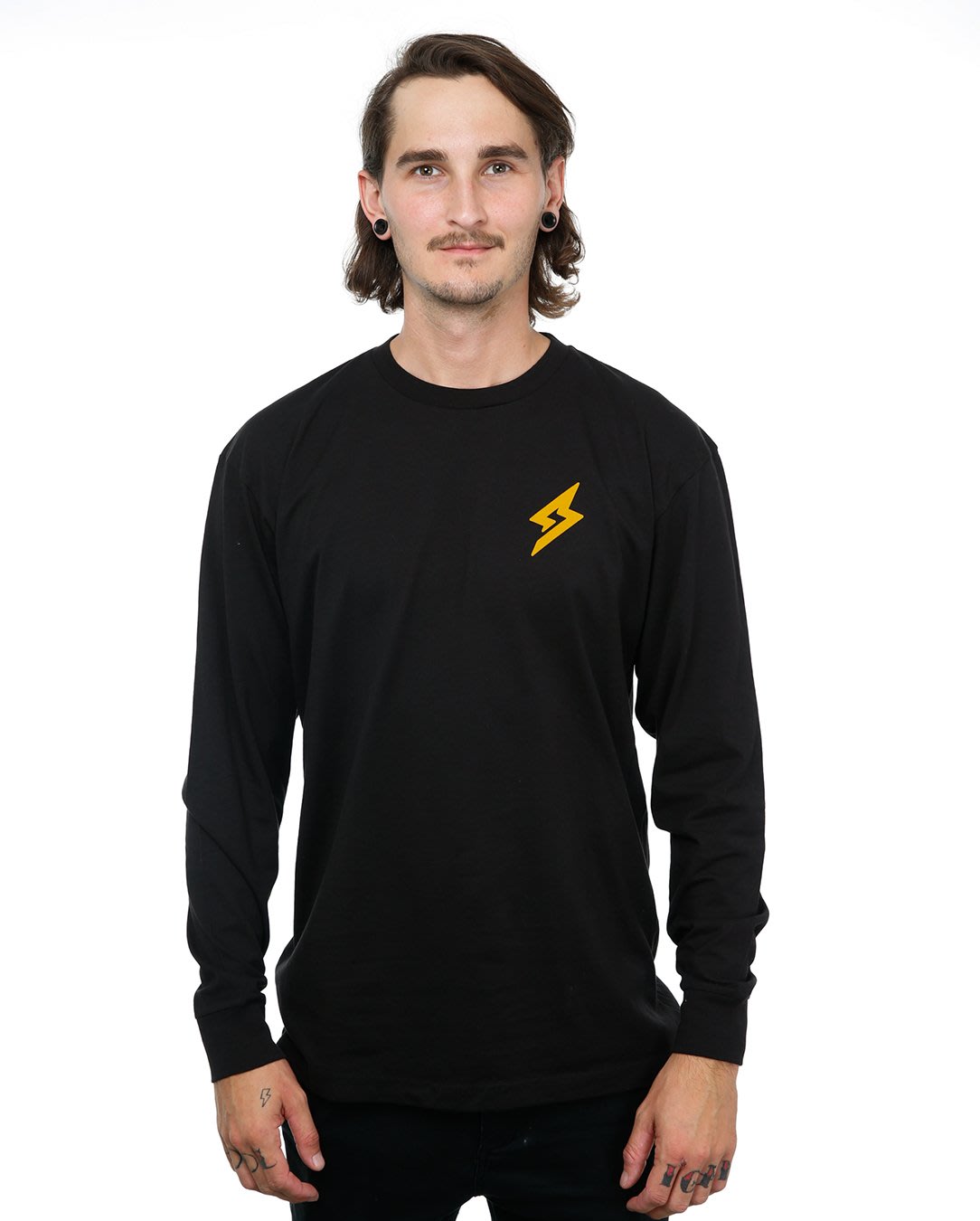Front view of male model in Black Adventure Long Sleeve T-Shirt on white background.