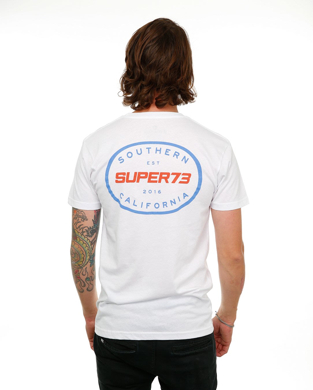 Back view of male model in White Oval Tee on white background.
