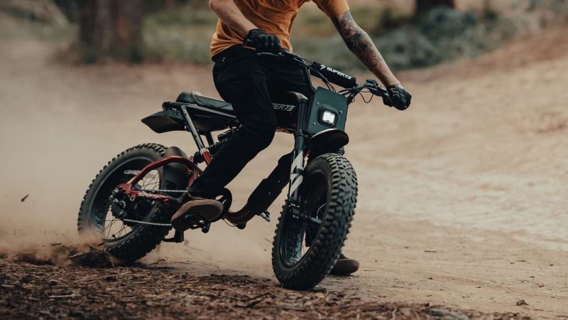 Man riding bike in dirt showcasing accessories for the RX