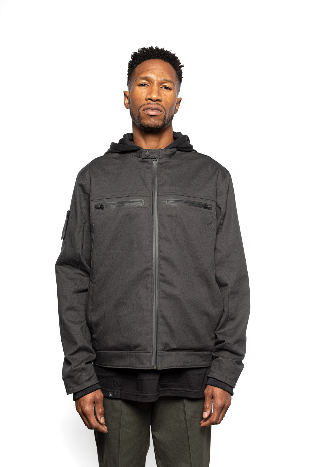 Male model wearing Chisel Hooded Jacket in gravel colorway.