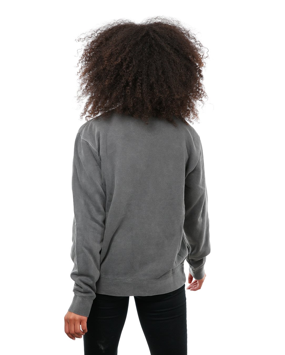 Back view of female model in Pigment Black Classic Crew Sweatshirt on white background.