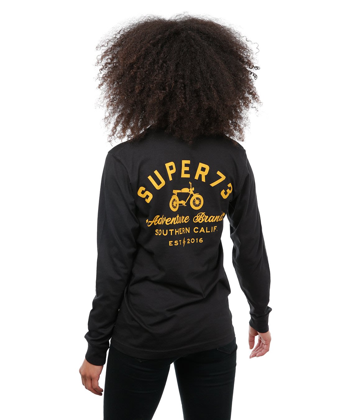 Back view of female model in Black Adventure Long Sleeve T-Shirt on white background.
