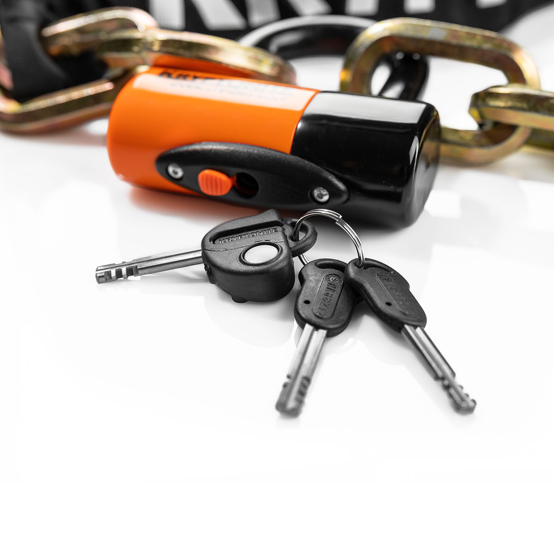 kryptonite lock on white background closeup with keys