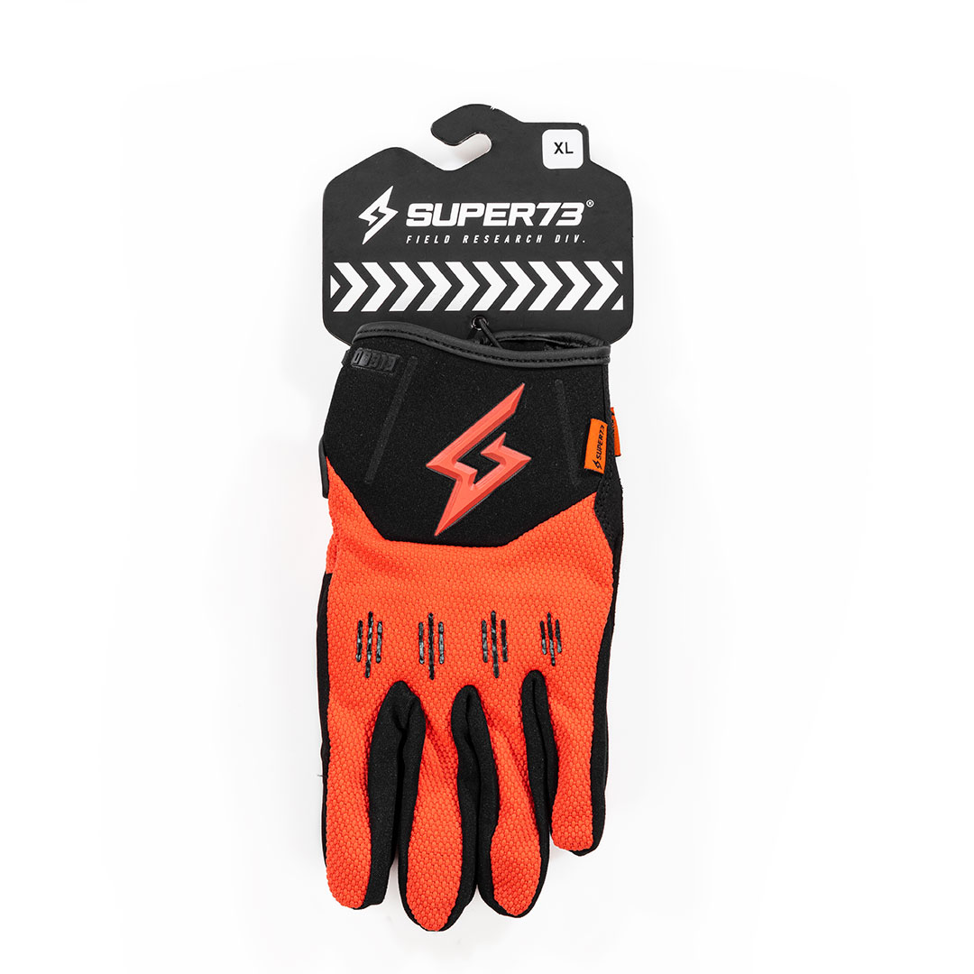 Orange glove in packaging on white background