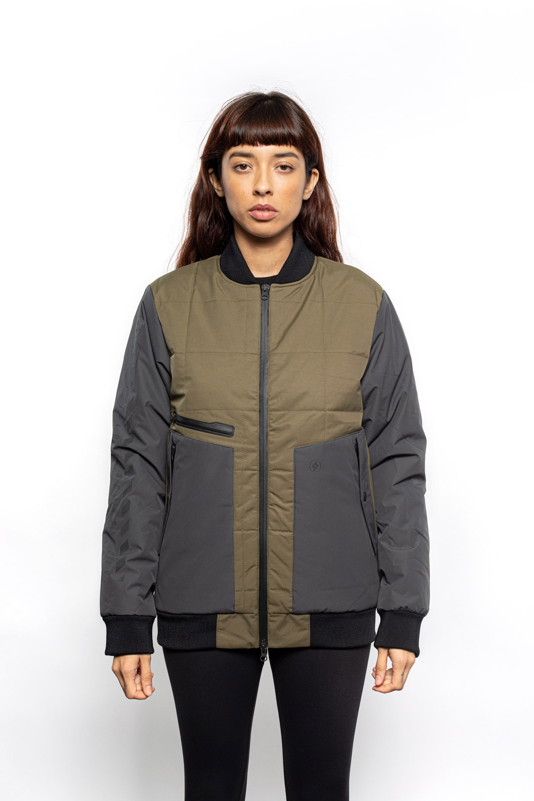 Female model wearing Sipes Varsity Jacket in dark fatigue colorway.