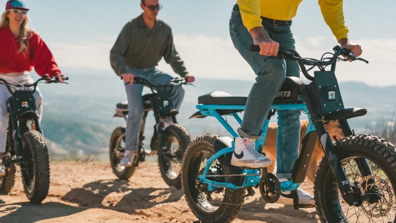 Super73 LP AYTK RSeries Three friends riding R-series ebikes across a dirt trail