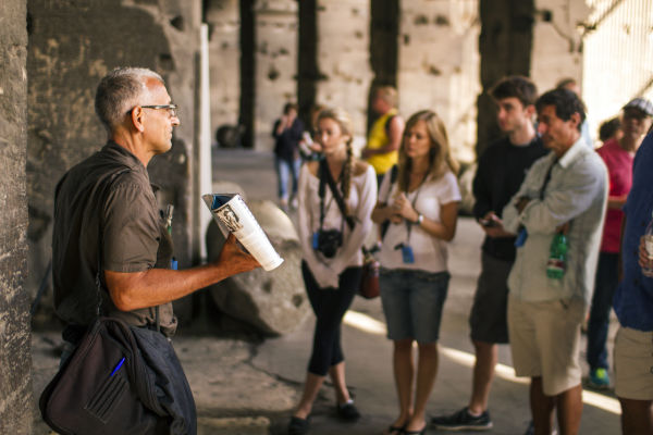 A Walks guide shows guests how the Colosseum looked nearly 2,000 years ago