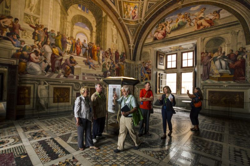 The School of Athens (background) is the most famous work in the Raphael Rooms