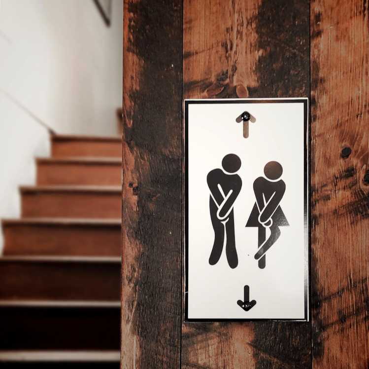 restroom sign: burning while peeing may be a sign of infection