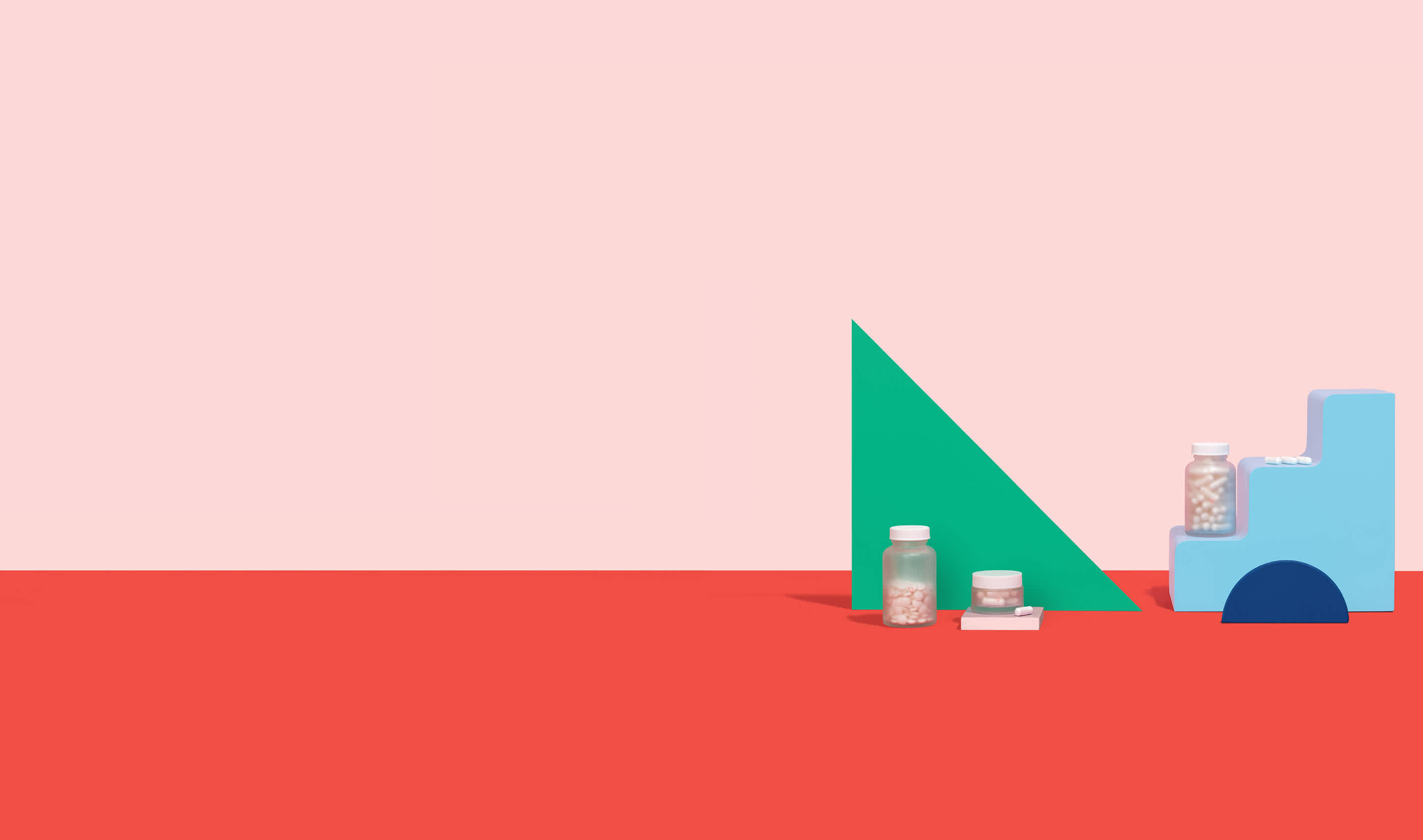 A collection of genital care supplements and medications balanced on colorful geometric shapes.