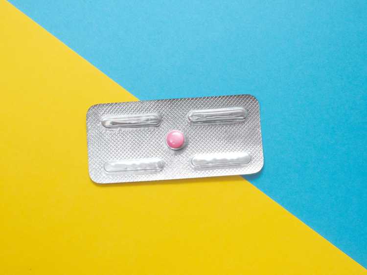 A Plan B pill on a blue and yellow background.