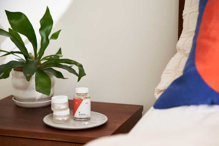Wisp cold sore prescriptions and over-the-counter treatment on a nightstand.