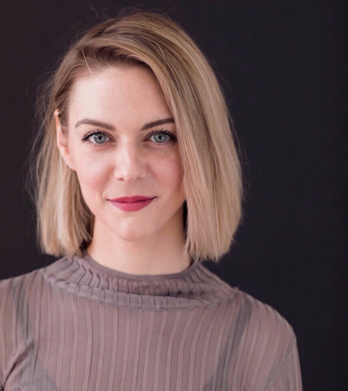 The headshot of Taylor Lhamon