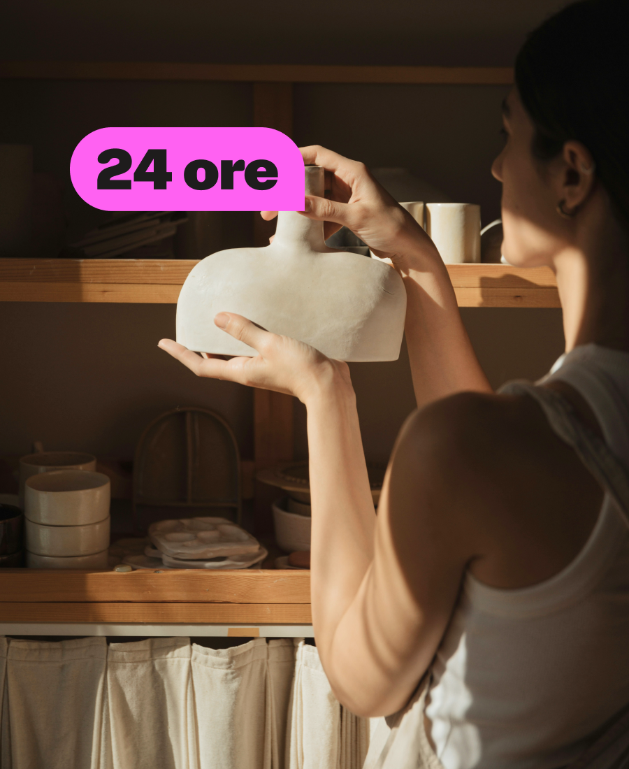 Lady holding a piece of pottery