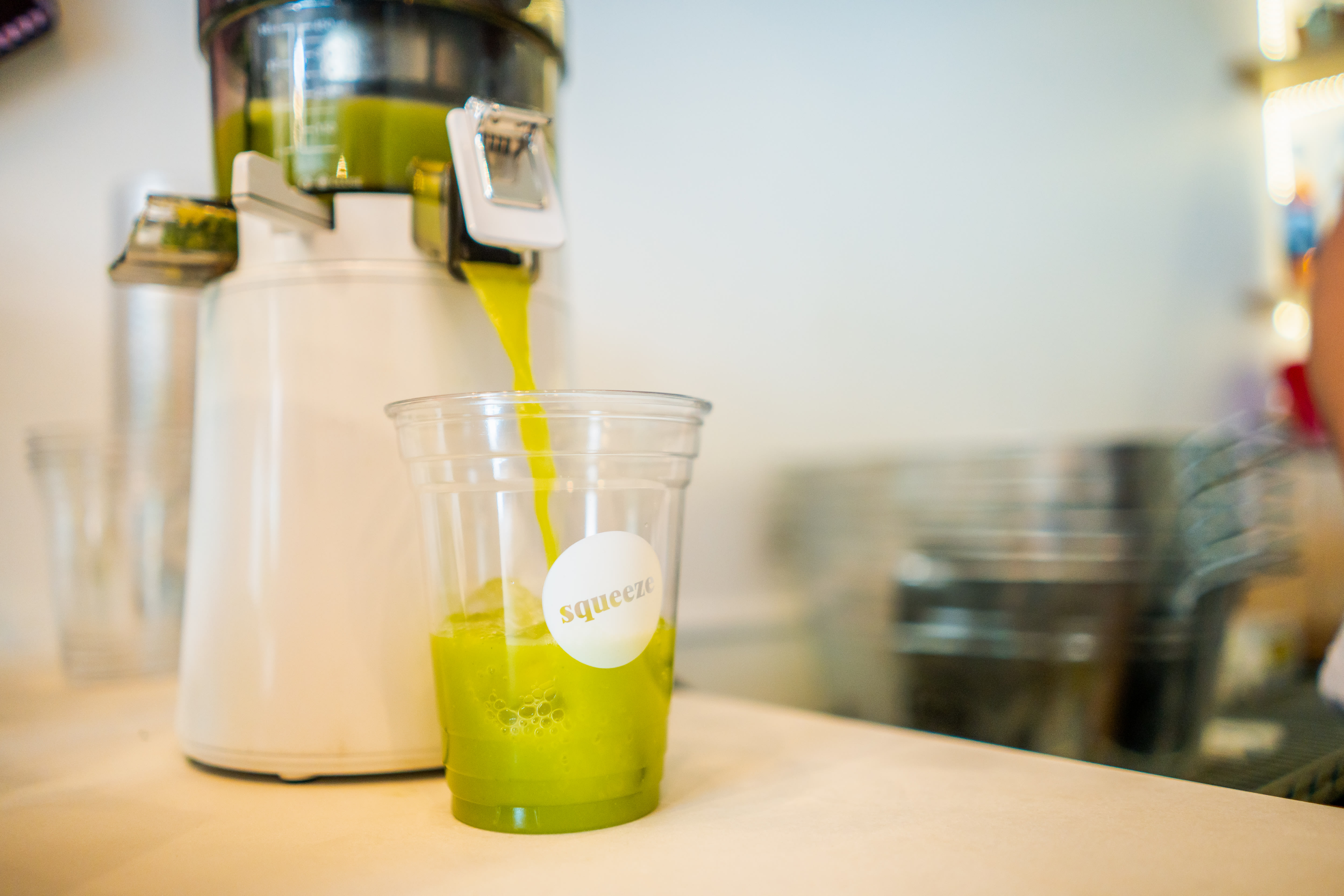 Juice being served in a cup at juice restaurant.