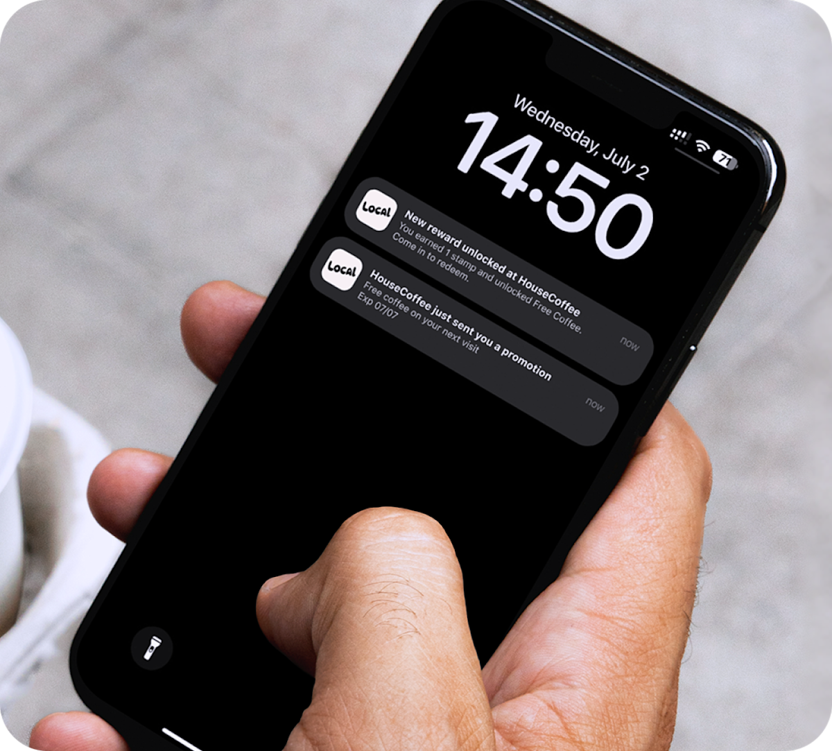 Close-up of a smartphone lock screen showing SumUp Local notifications about a new reward and promotion.