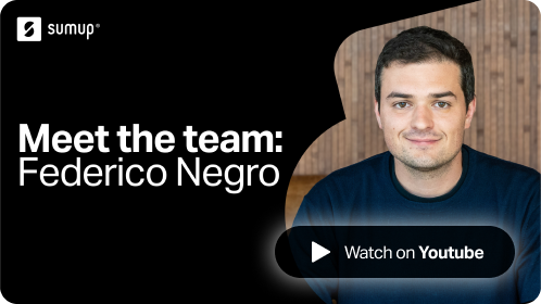 Artwork with text reading "Meet the team: Federico Negro" with a young male SumUpper wearing a dark blue sweater with short black hair in front of a wooden wall.
