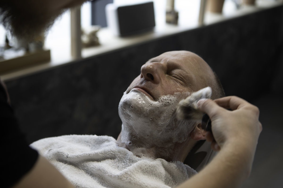 man-relaxing-shaving