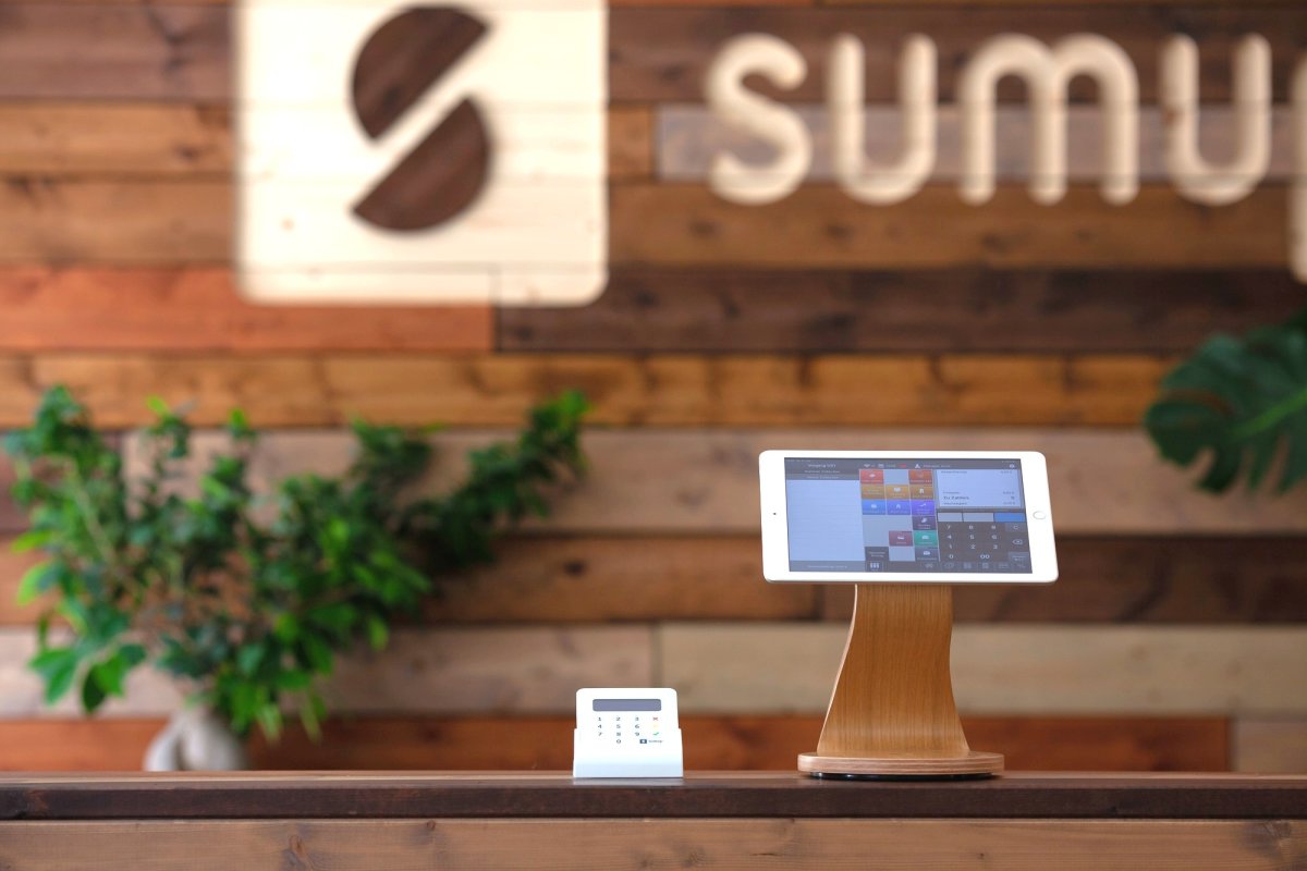 Tablet on a stand and card reader at the counter