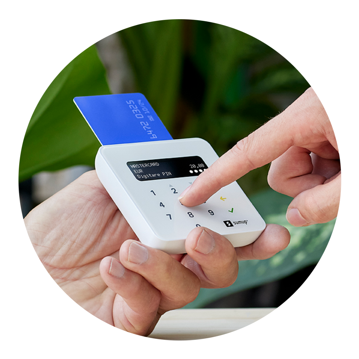 A payment card hovers over the SumUp Air card reader