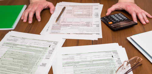 business person filling out tax forms