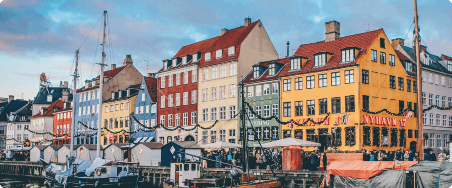 Famous Copenhagen landmark with colourful buildings and boats 