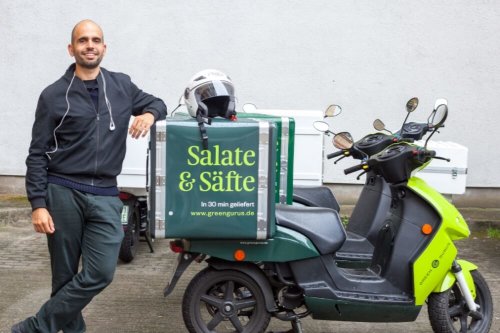food delivery driver with moped