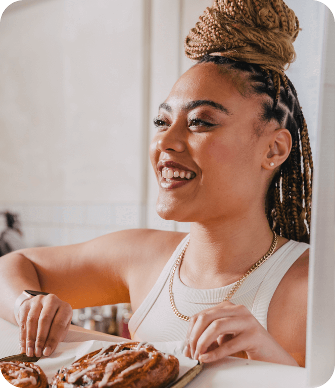Image of a smiling barista behind the counter