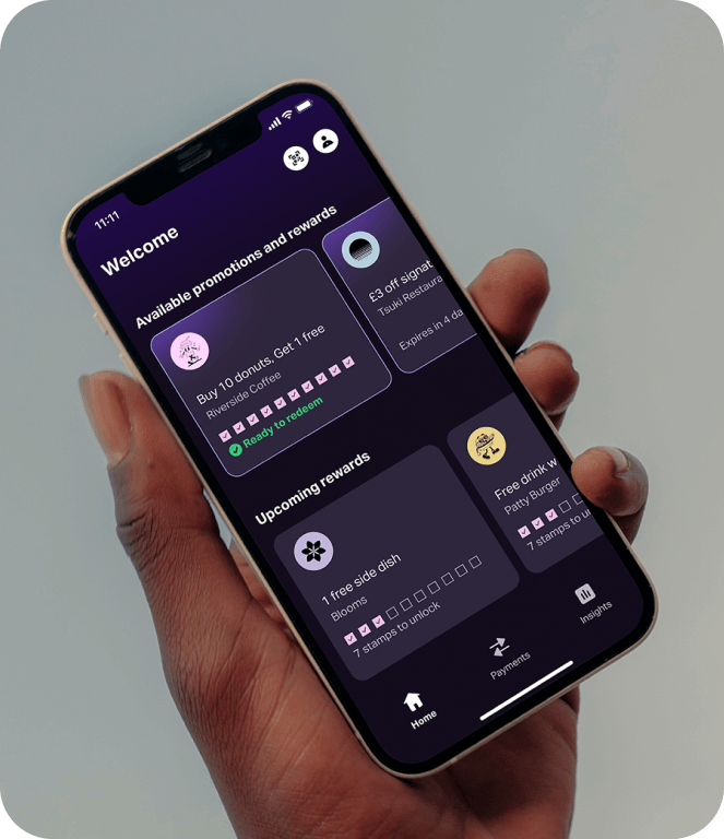 Image of hand holding phone showing rewards app