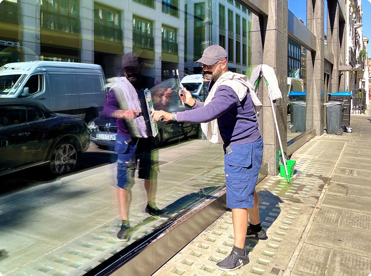Image of a window cleaner cleaning a window