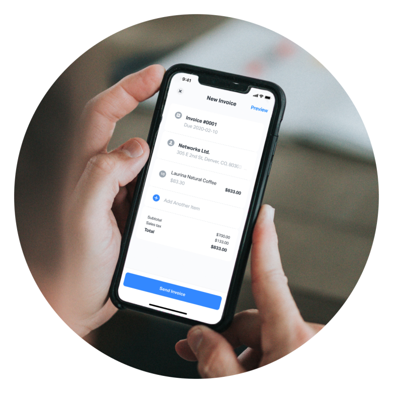 Person holding a mobile phone, using the SumUp app to create a new invoice with SumUp Invoices. The app allows you to easily create invoices for your business from mobile or web.