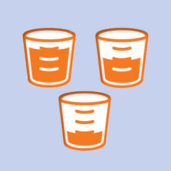 Three measuring cups filled with Infant and Children liquid medication.