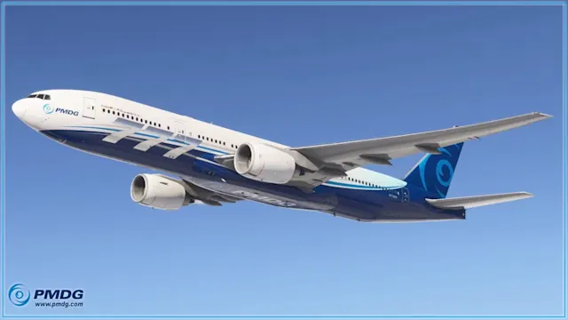 The PMDG 777 flying in a blue cloudless sky.