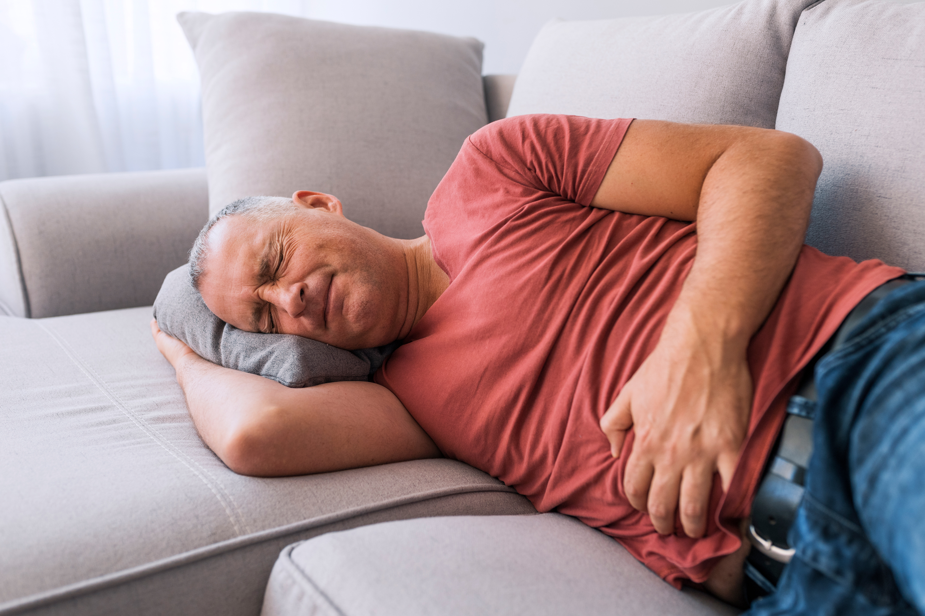 Man suffering from stomach pain
