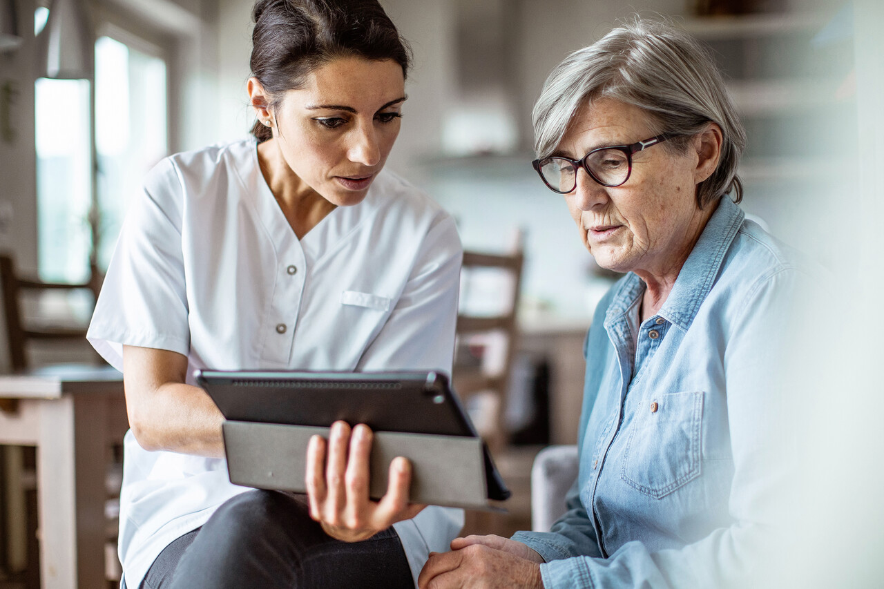 Senior woman and doctor talking