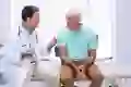 Senior patient talking to doctor