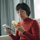 Person reading a prescription drug bottle