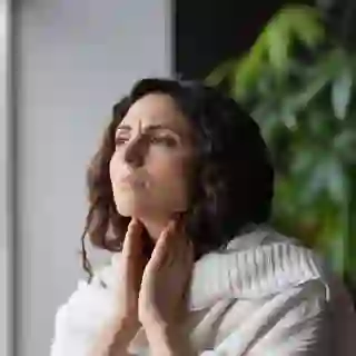 Woman checking swollen glands