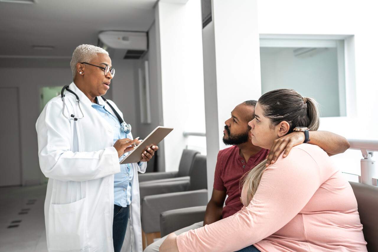 Couple talking to a doctor