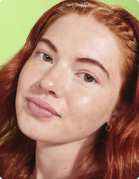 woman with red hair, green background