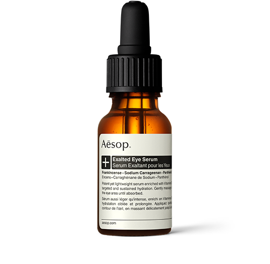 Exalted Eye Serum in einer bernsteinfarbenen Glasflasche mit Pipette. 