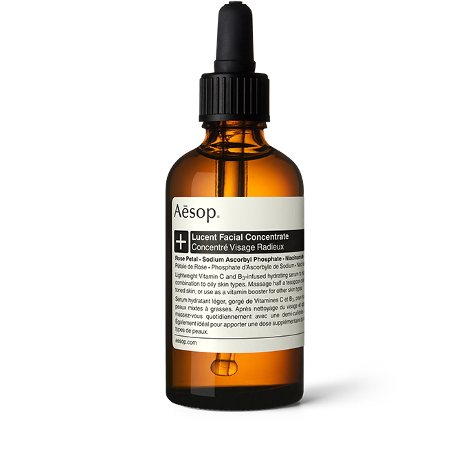 Lucent Facial Concentrate en un frasco de vidrio ámbar con pipeta.