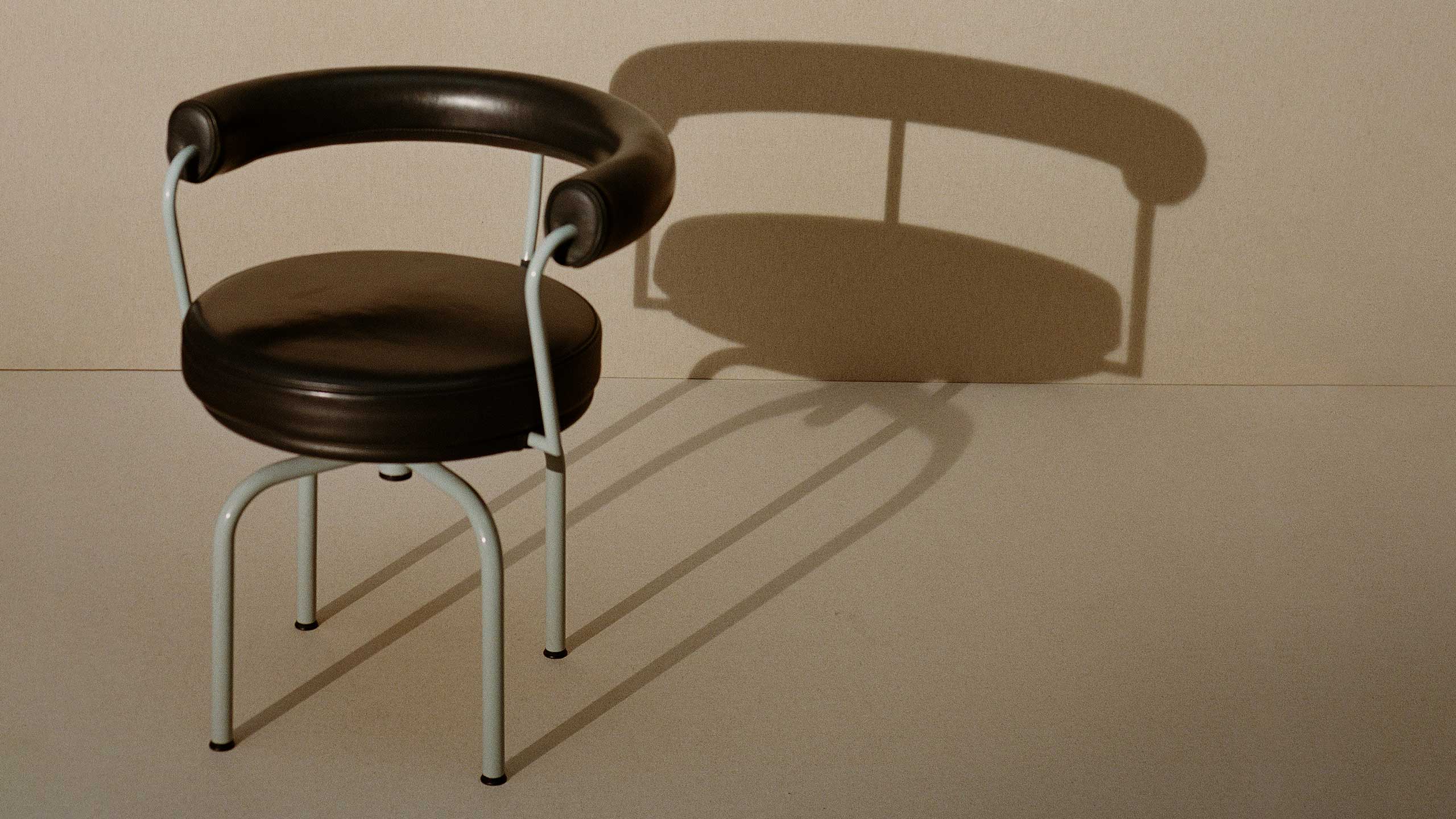 A modernist chair designed by Charlotte Perriand.