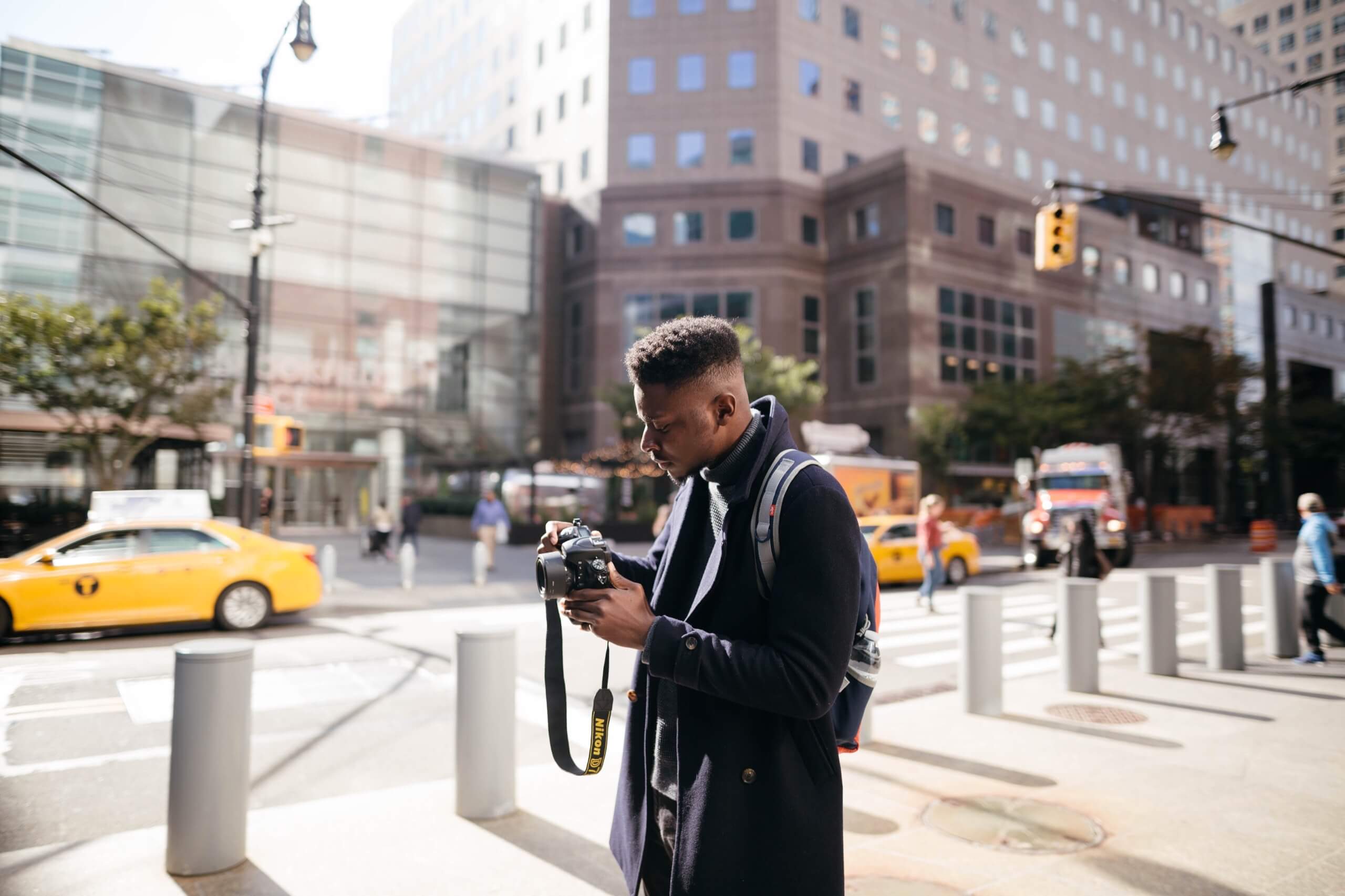 photographer with camera backpack