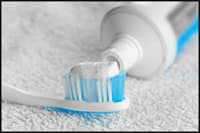 Photo of toothpaste applied to toothbrush.