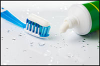 Photo of toothpaste applied to toothbrush.