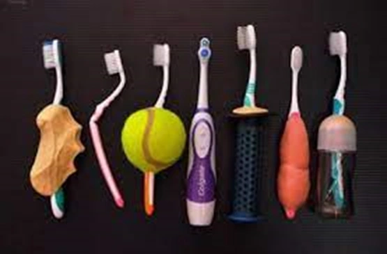 Photo showing modified oral hygiene devices for patient usability