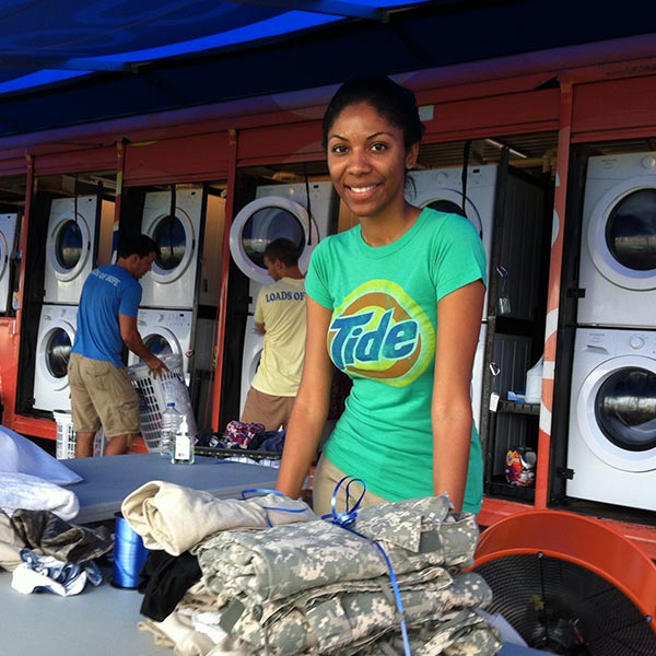 Woman in mobile laundry unit