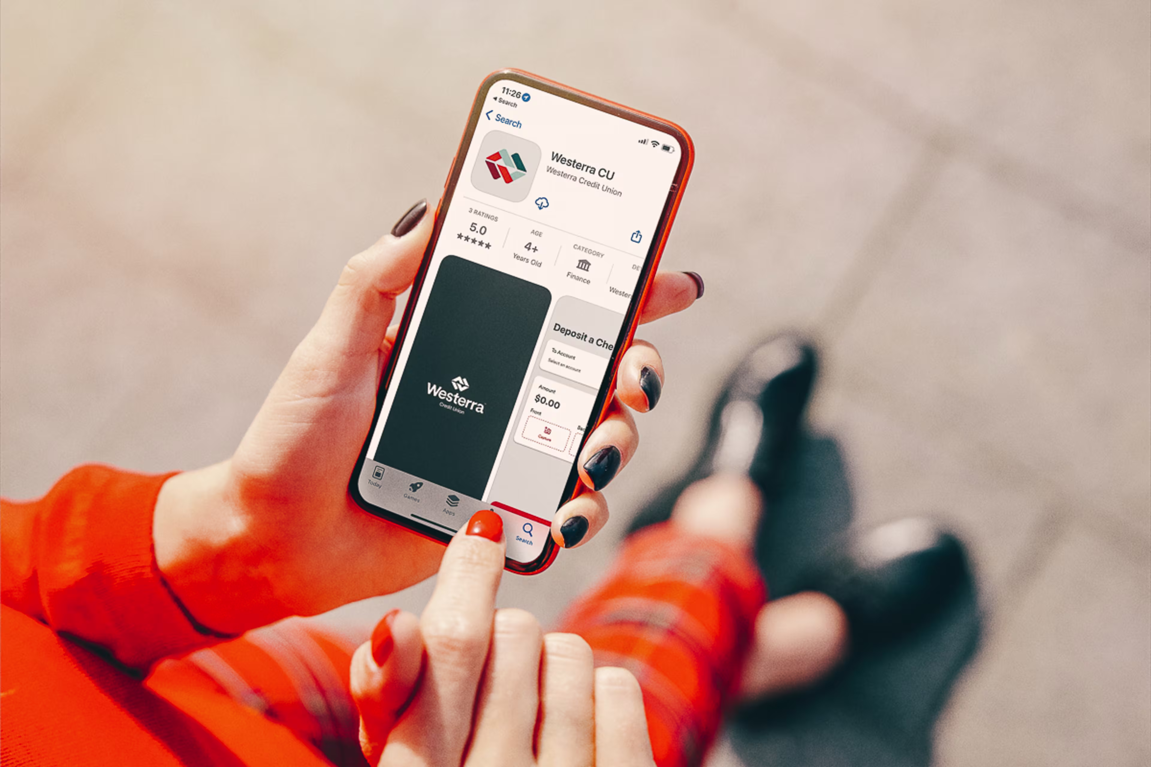 Person downloading Westerra Digital Banking on their phone