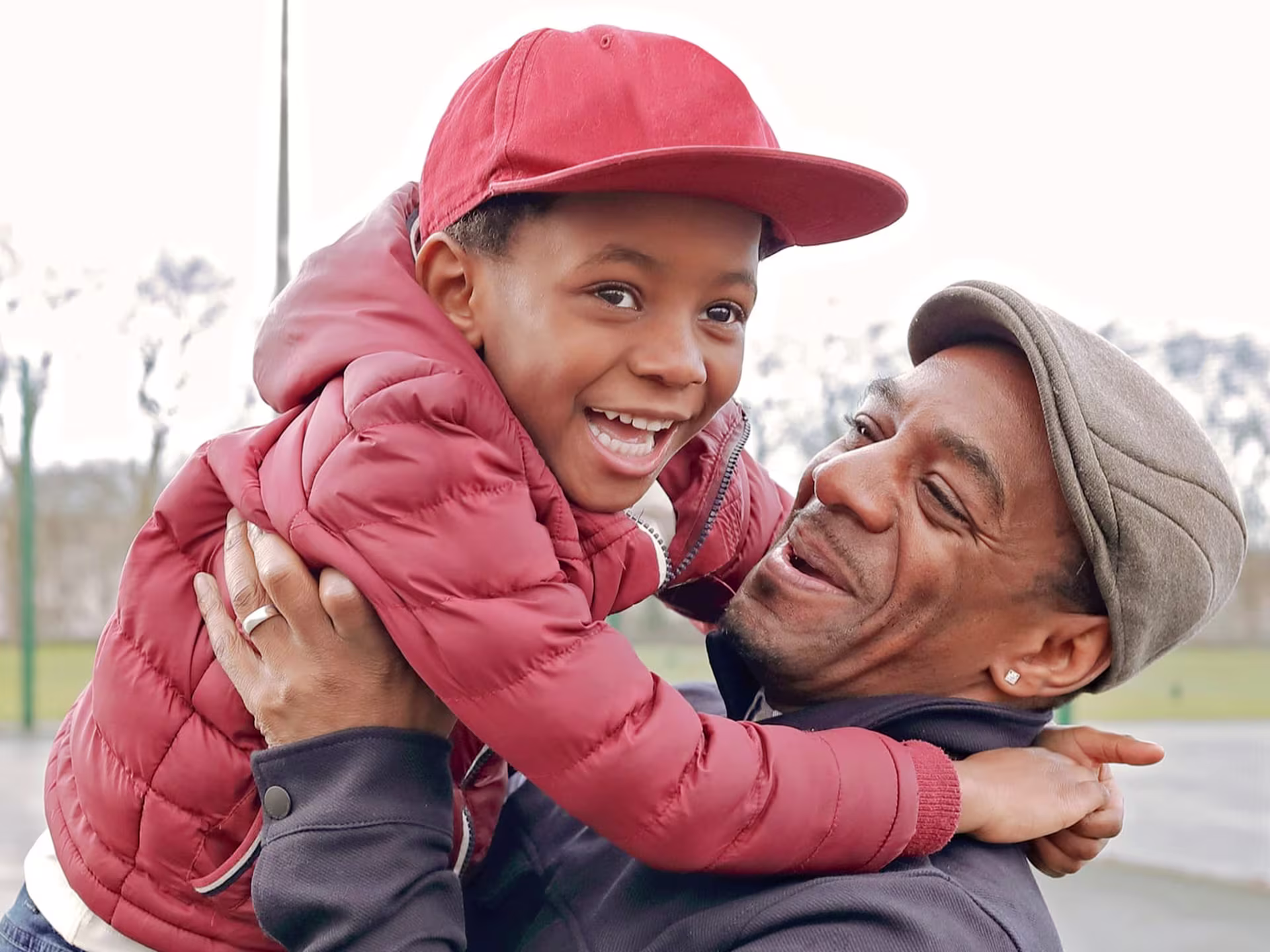 Man happily holding his son